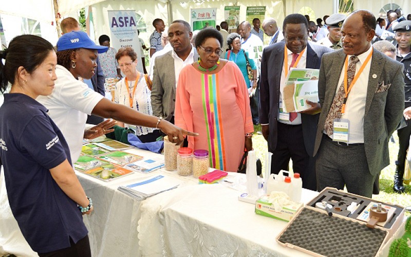  - Hon. Mary Karooro Okurut representing the Prime Minister tours the exhibitions at the 2nd Joint NARO-MAK Conference, November 2018 at Speke Resort Hotel, Munyonyo
