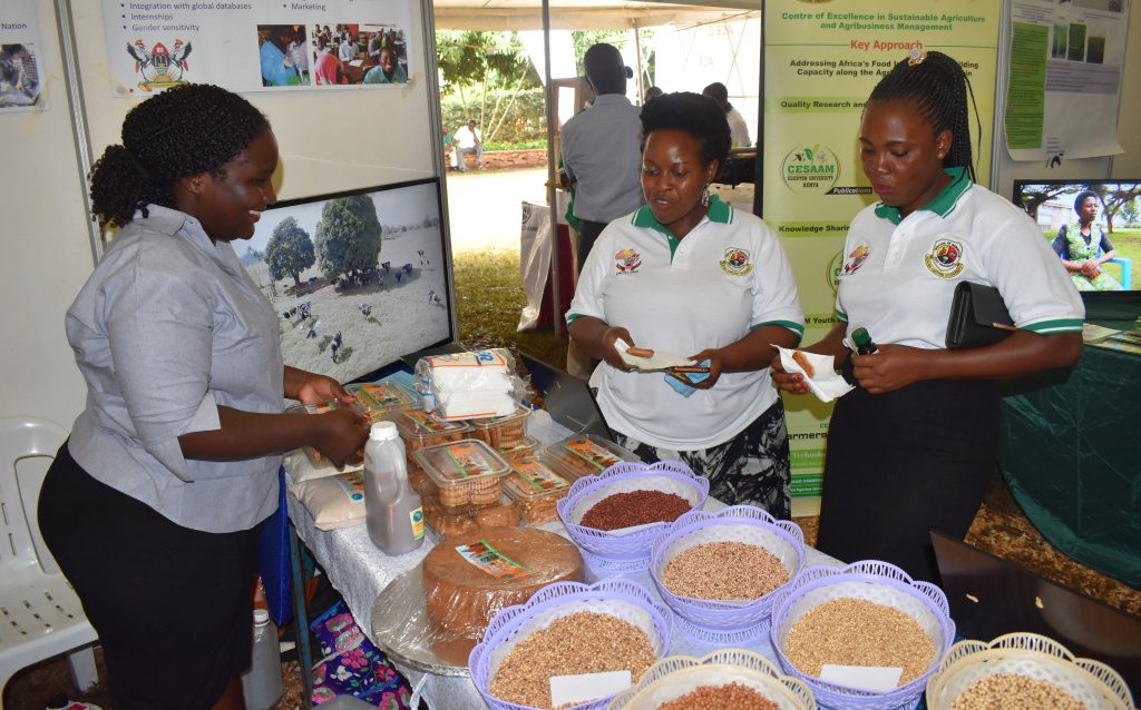  - MaRCCI PhD sudent Bigirwa Stella serves cowpea cookies to some of the conference goers